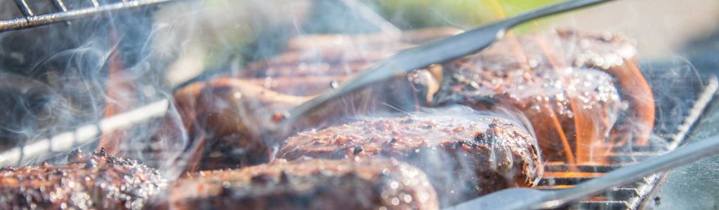 close-photography-of-grilled-meat-on-griddle